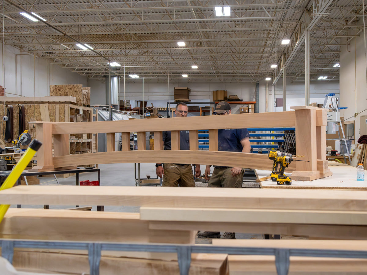 Craftsmen Inspecting Heirloom Shuffleboard Table Build