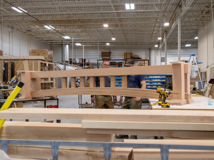 Craftsmen Inspecting Heirloom Shuffleboard Table Build