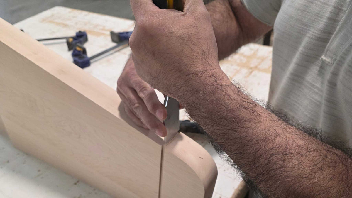 Craftsmanship Handcrafted Wood Chisel work on rock Ola Leg 