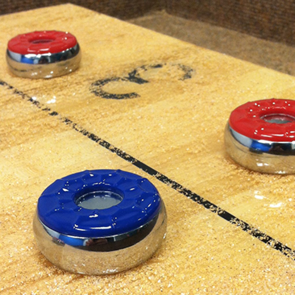Hold a Block-Party-Turned-Shuffleboard-Tournament out of Your Family's Garage