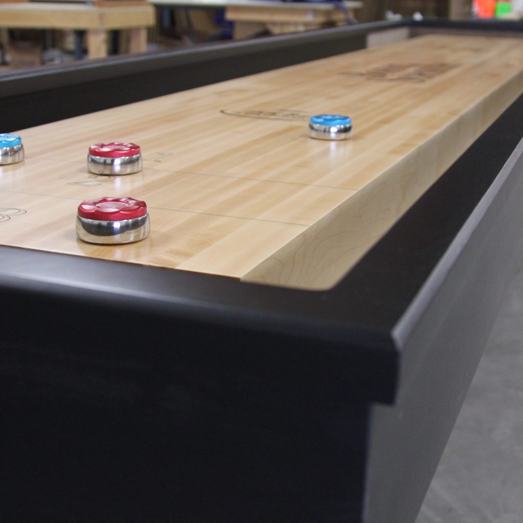 A Workplace Shuffleboard League Really Brings the Office Together